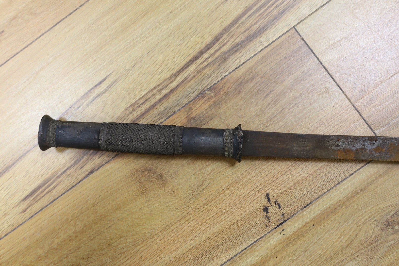 Two Burmese dha swords.